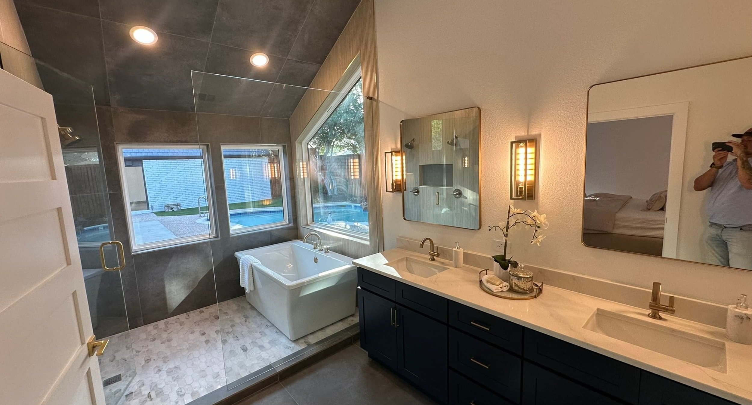 Renovated kitchen with dark cabinetry and gold hardware, completed by Buffalo Ridge Construction